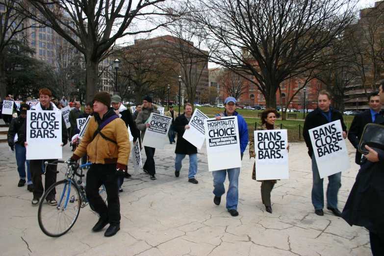 several people holding signs that say bacter case rules
