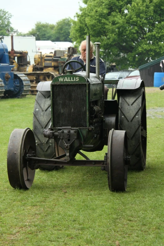 this is an old tractor with huge wheels on it