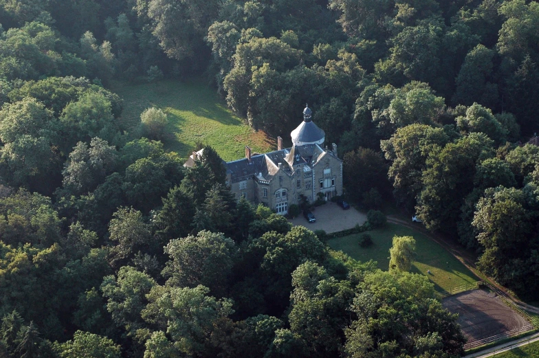 an aerial view of an old castle with a clock
