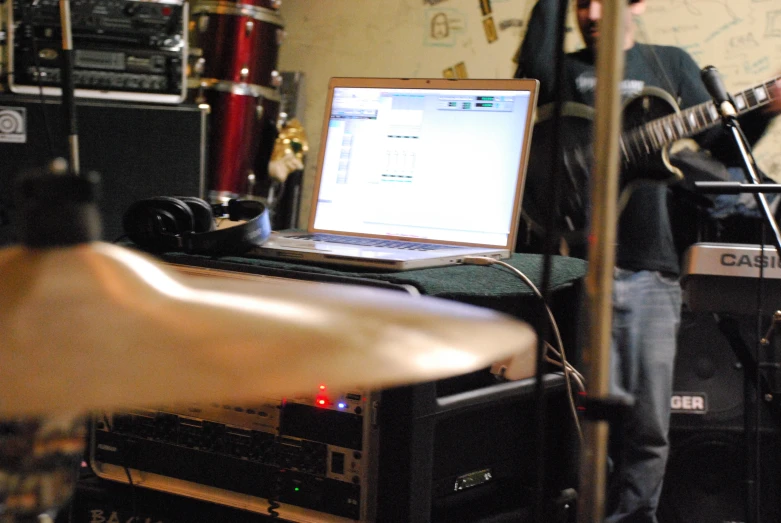 a man playing music next to some other equipment