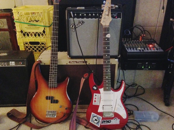 the guitars are lined up in a room