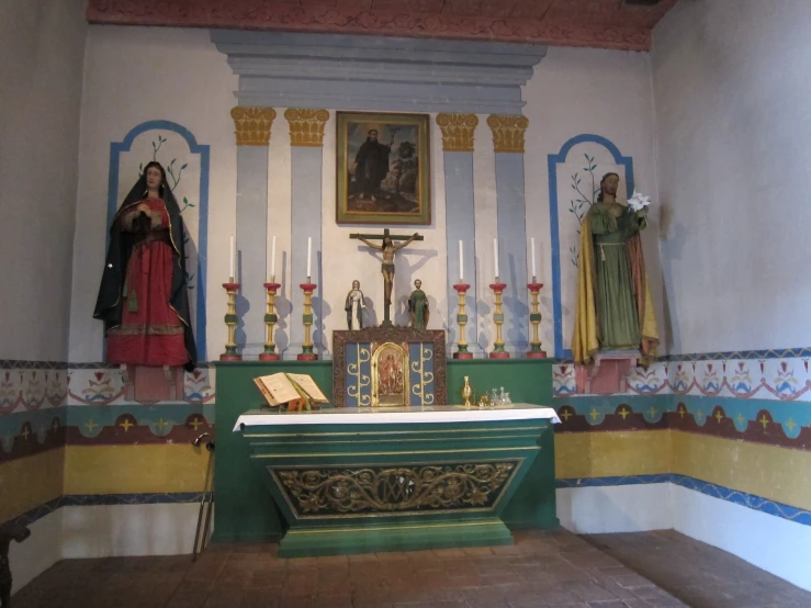 a po of a cross, some religious icons, and an altar