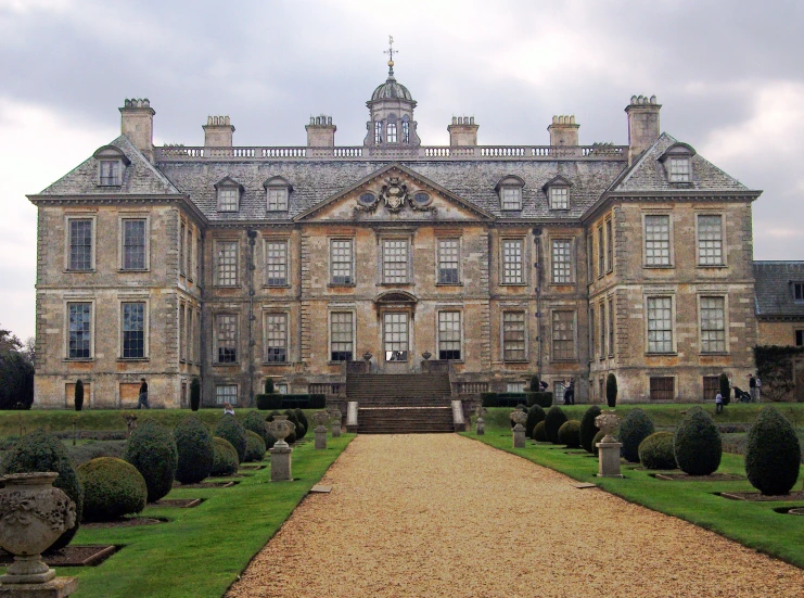 an image of a large building with a walkway in front of it