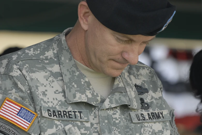 a man in a military uniform in front of a crowd