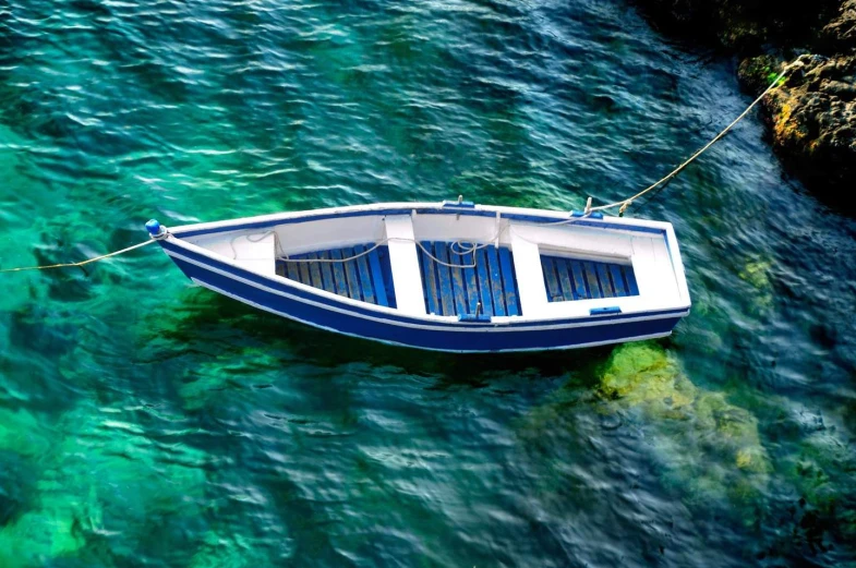 a small boat on the water near the shore