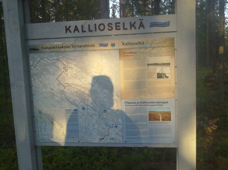 a sign is shown with a shadow on it