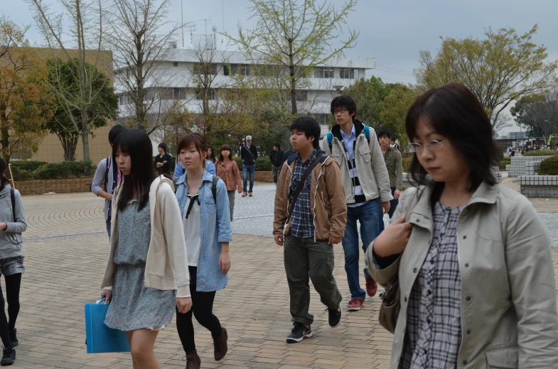 a group of people standing on the street