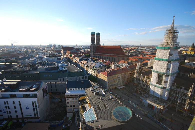 a city with lots of buildings and a large clock tower