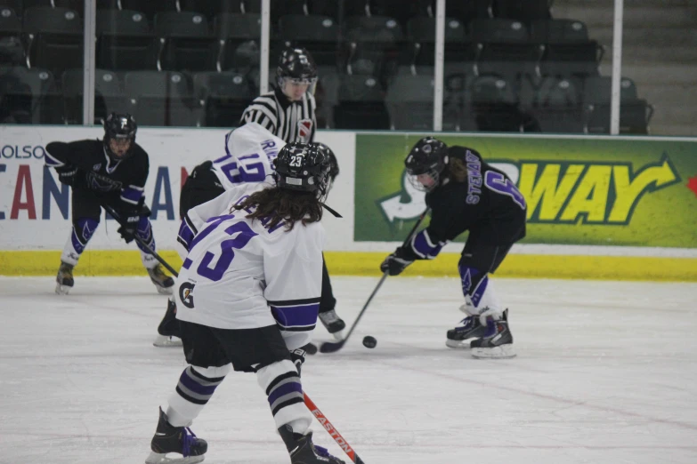 women's hockey players on the ice in action