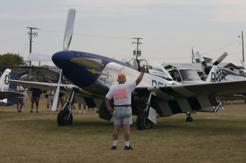 the person standing near the plane has an american flag on it