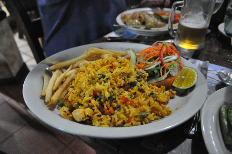 a big white plate filled with food sitting on a table