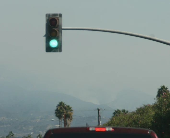 street light over head with mountains in the background