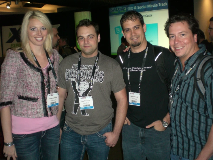 several people standing together smiling at the camera