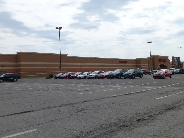 a row of parked cars in front of a building