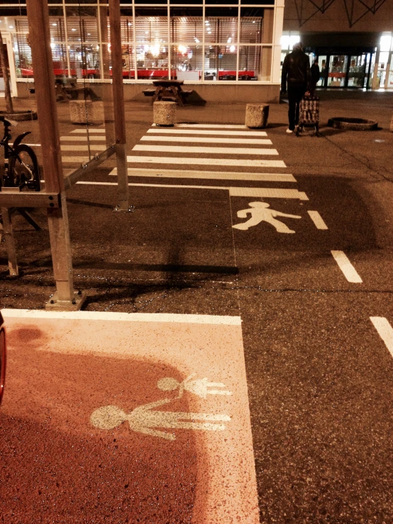 a street with a pedestrian walking in an intersection