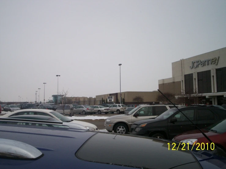 cars are parked in front of a business