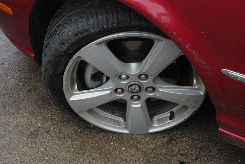 a red car with four spokes and ke pads