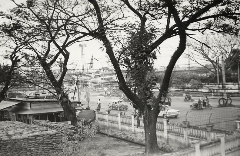 black and white image of a park next to a river