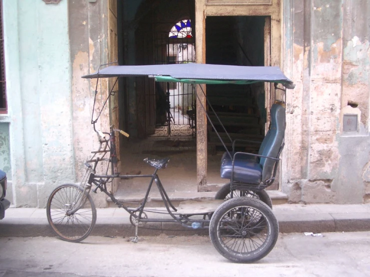 the tricycle has a single passenger and a sidecar