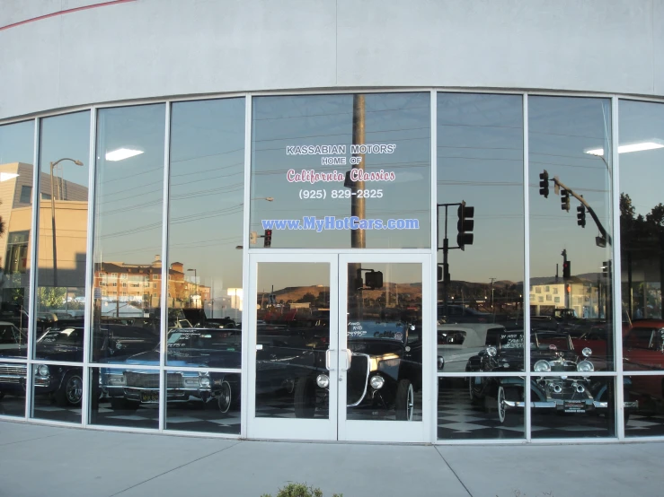 an automotive dealership is full of cars and some stoplights