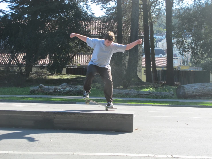 a man is jumping a block on a skateboard