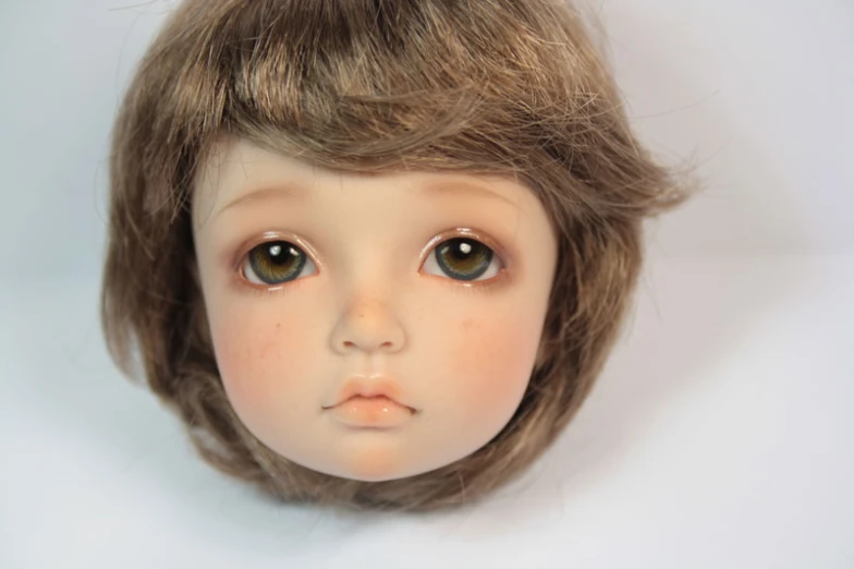 there is a close up po of a doll head
