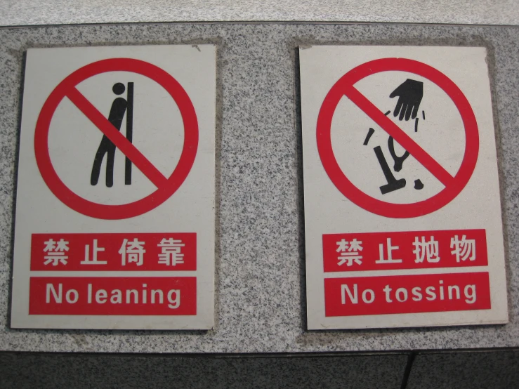 there are two signs with the language of no cleaning and no to tossing