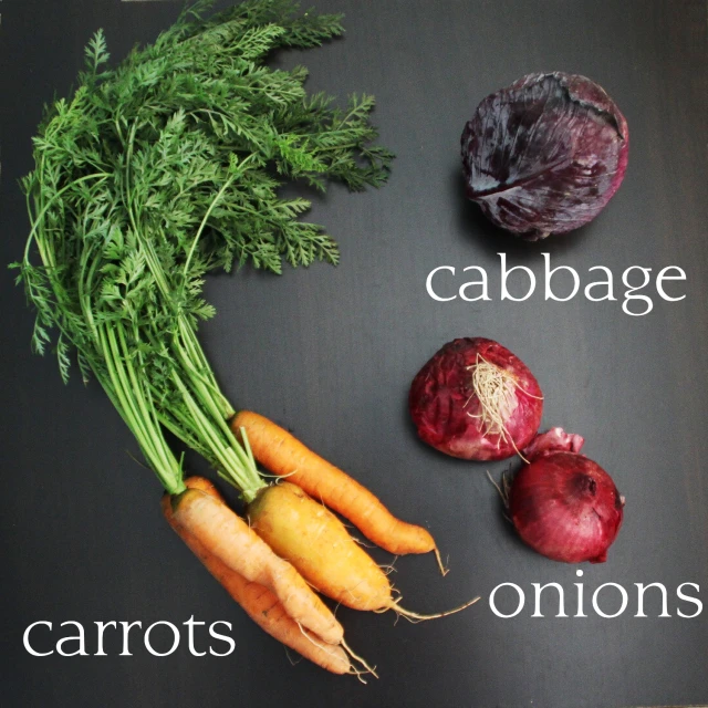 a table filled with different vegetables on it