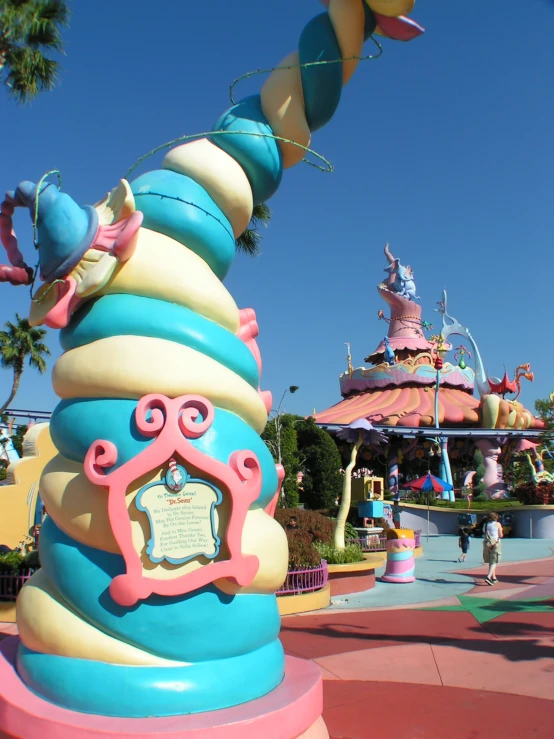 a tower with several decorations in front of a castle