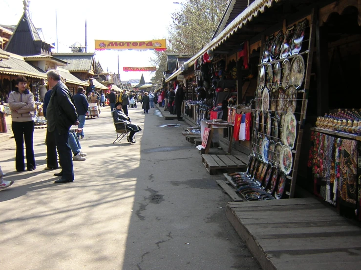 the people are at the market near the buildings