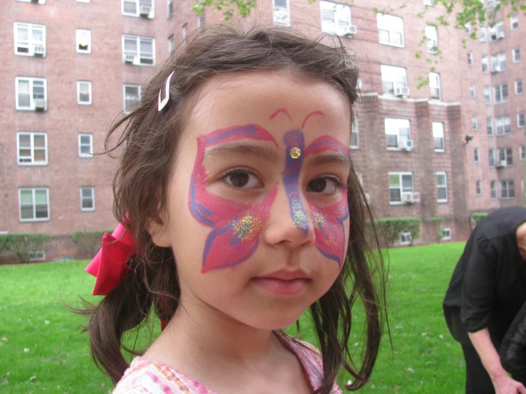 a  with face paint looking at the camera