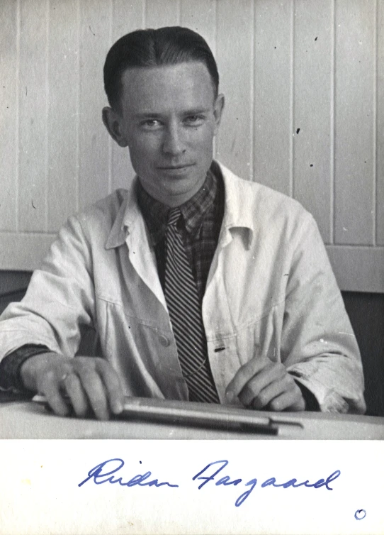 a black and white po of a man at a table