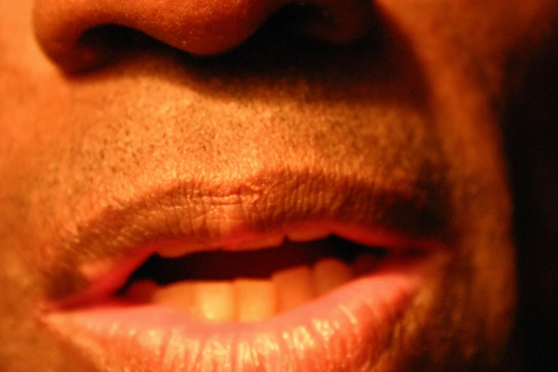 a close up image of the mouth of a man