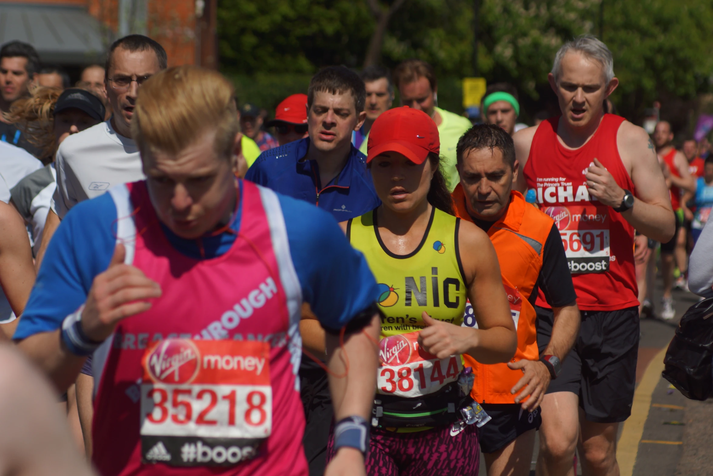 many men are running together in the street