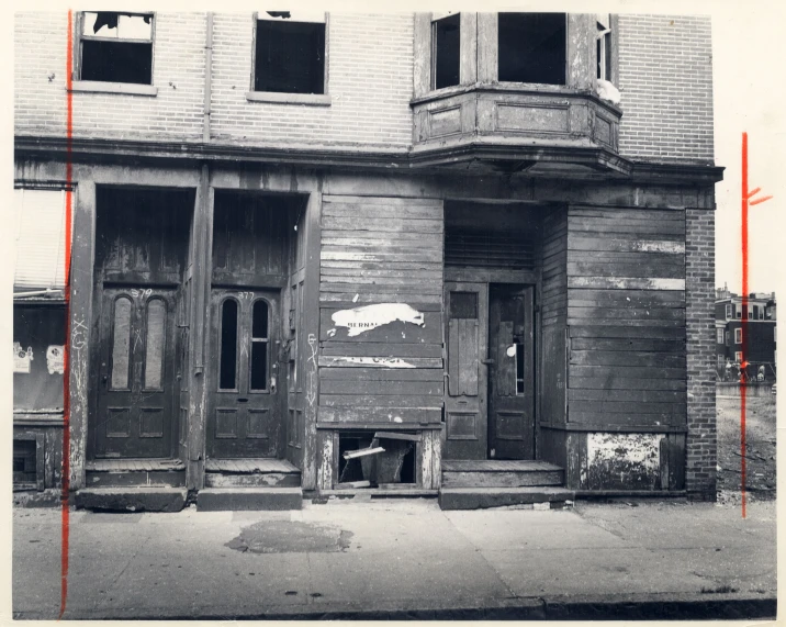 an old black and white po of the outside of a building