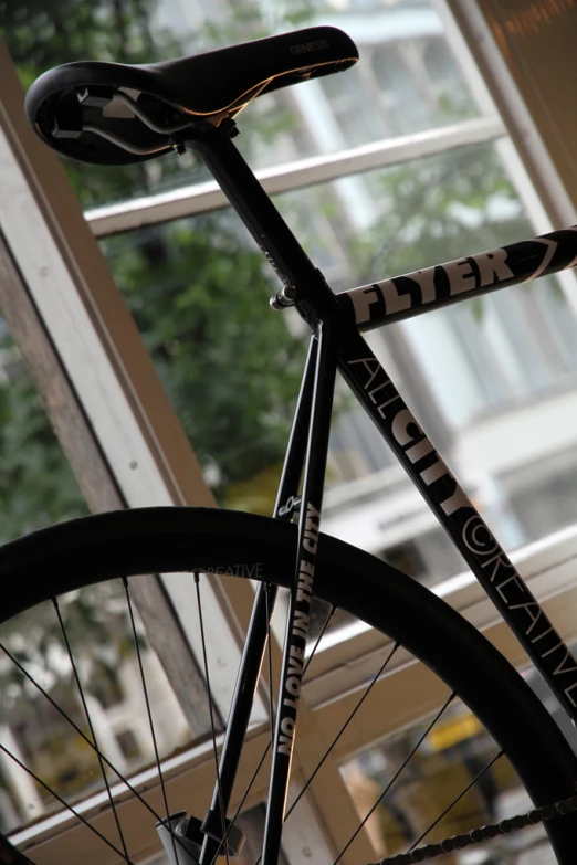 a bike is leaning against a window ledge