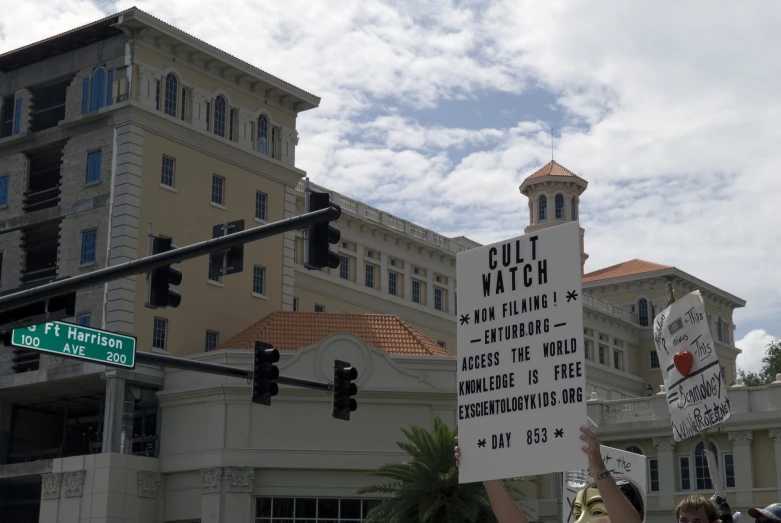 street signs protesting against guns and  at city intersection