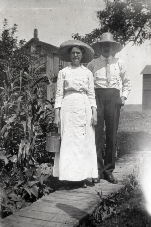 an old black and white po with a man wearing a cowboy hat