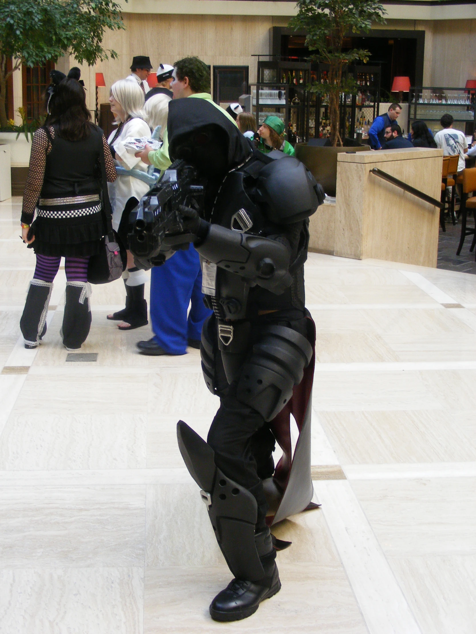 man in full body armor posing for camera with group