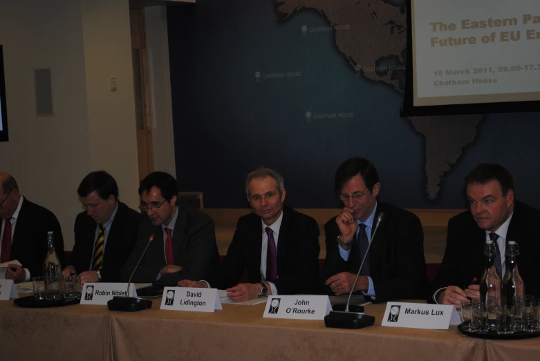 a group of people sitting at a table together