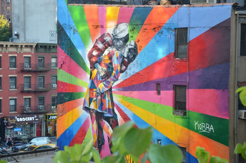 a mural on the side of a building depicting a woman and flowers