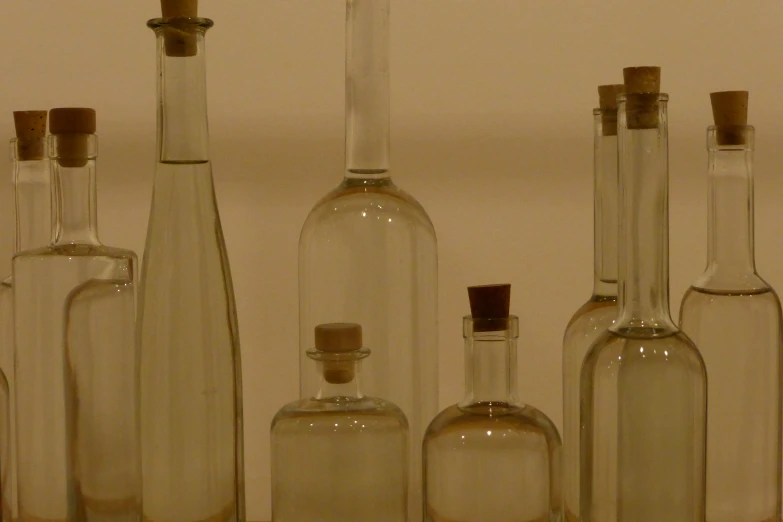 a large collection of liquor bottles next to each other