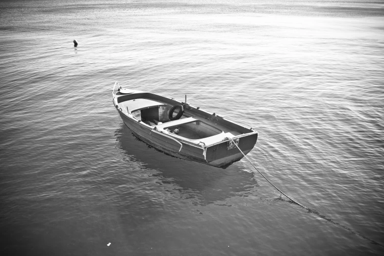 an old wooden boat floating on a calm river