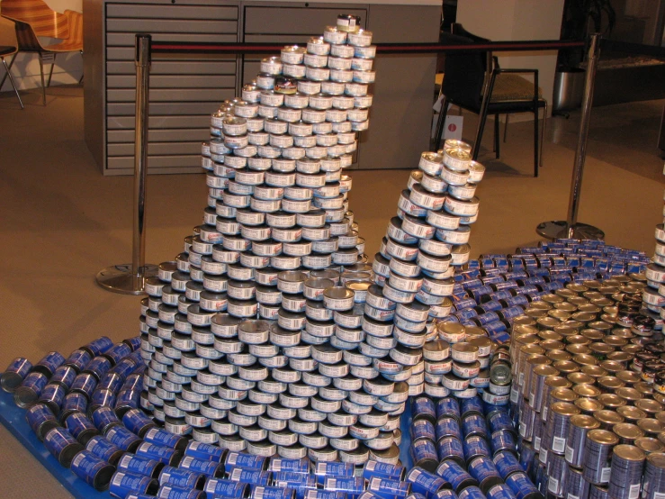 stacks of stacked up plastic cans in a room