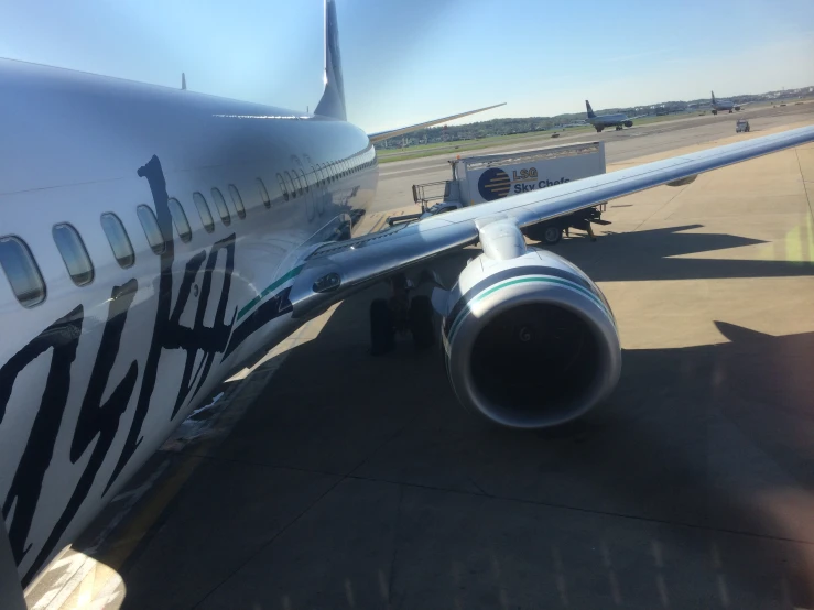 an airplane parked at a boarding deck on a run way