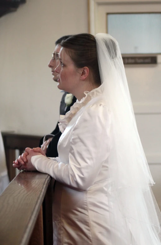 the bride and groom are in church wedding ceremony