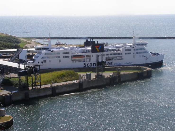 the ferry boat is docked in the harbor