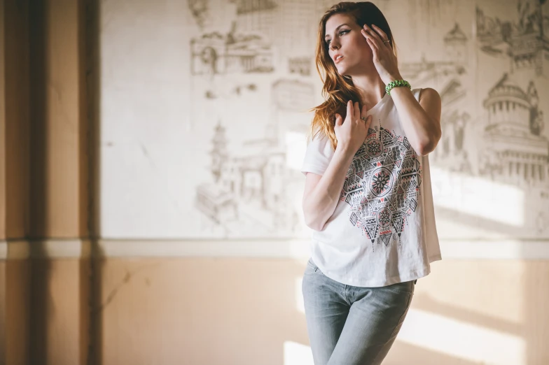 a woman in white shirt holding a pair of scissors