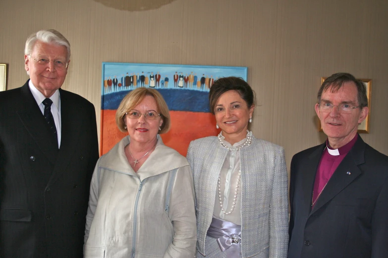 two men and two women pose for a picture