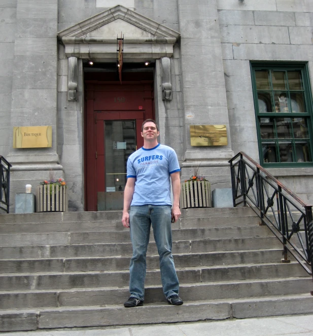 a man standing on a step near stairs